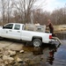 U.S. Fish and Wildlife Service personnel stock trout at Fort McCoy lakes