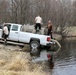 U.S. Fish and Wildlife Service personnel stock trout at Fort McCoy lakes