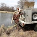 U.S. Fish and Wildlife Service personnel stock trout at Fort McCoy lakes
