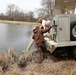 U.S. Fish and Wildlife Service personnel stock trout at Fort McCoy lakes