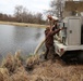 U.S. Fish and Wildlife Service personnel stock trout at Fort McCoy lakes