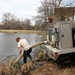 U.S. Fish and Wildlife Service personnel stock trout at Fort McCoy lakes