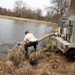U.S. Fish and Wildlife Service personnel stock trout at Fort McCoy lakes