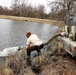 U.S. Fish and Wildlife Service personnel stock trout at Fort McCoy lakes