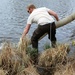 U.S. Fish and Wildlife Service personnel stock trout at Fort McCoy lakes