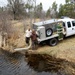 U.S. Fish and Wildlife Service personnel stock trout at Fort McCoy lakes