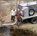 U.S. Fish and Wildlife Service personnel stock trout at Fort McCoy lakes