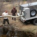 U.S. Fish and Wildlife Service personnel stock trout at Fort McCoy lakes