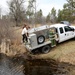 U.S. Fish and Wildlife Service personnel stock trout at Fort McCoy lakes
