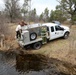U.S. Fish and Wildlife Service personnel stock trout at Fort McCoy lakes