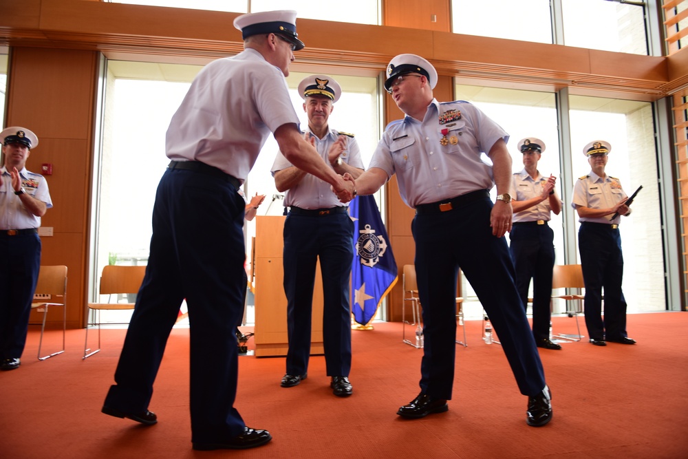 Atlantic Area Command Master Chiefs shake hands at a Change of the Watch ceremony