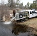 U.S. Fish and Wildlife Service personnel stock trout at Fort McCoy lakes