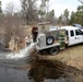 U.S. Fish and Wildlife Service personnel stock trout at Fort McCoy lakes