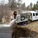 U.S. Fish and Wildlife Service personnel stock trout at Fort McCoy lakes