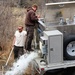 U.S. Fish and Wildlife Service personnel stock trout at Fort McCoy lakes