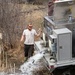 U.S. Fish and Wildlife Service personnel stock trout at Fort McCoy lakes