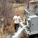 U.S. Fish and Wildlife Service personnel stock trout at Fort McCoy lakes