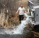 U.S. Fish and Wildlife Service personnel stock trout at Fort McCoy lakes