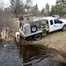 U.S. Fish and Wildlife Service personnel stock trout at Fort McCoy lakes