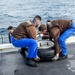 French Sailors Move Equipment Aboard GHWB
