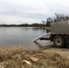 U.S. Fish and Wildlife Service personnel stock trout at Fort McCoy lakes