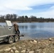 U.S. Fish and Wildlife Service personnel stock trout at Fort McCoy lakes