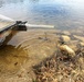 U.S. Fish and Wildlife Service personnel stock trout at Fort McCoy lakes