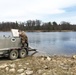 U.S. Fish and Wildlife Service personnel stock trout at Fort McCoy lakes