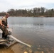 U.S. Fish and Wildlife Service personnel stock trout at Fort McCoy lakes