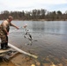 U.S. Fish and Wildlife Service personnel stock trout at Fort McCoy lakes