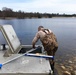 U.S. Fish and Wildlife Service personnel stock trout at Fort McCoy lakes