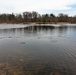 U.S. Fish and Wildlife Service personnel stock trout at Fort McCoy lakes