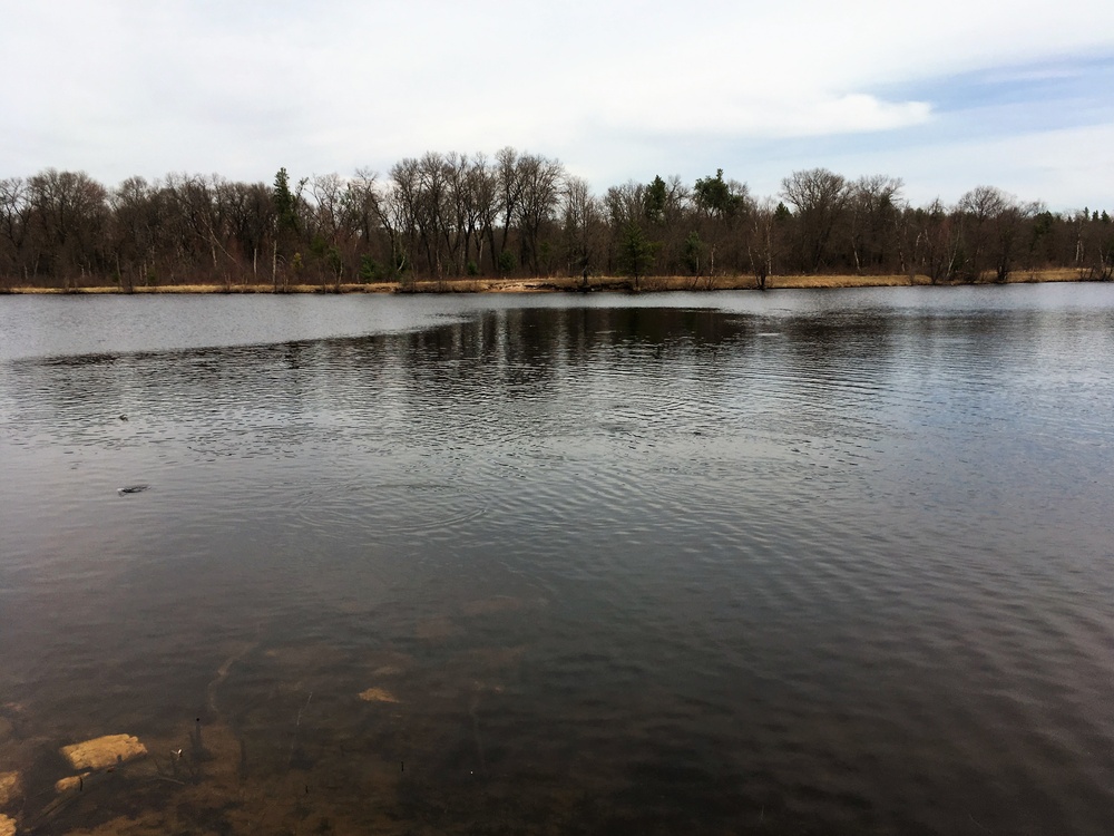 U.S. Fish and Wildlife Service personnel stock trout at Fort McCoy lakes