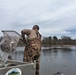 U.S. Fish and Wildlife Service personnel stock trout at Fort McCoy lakes