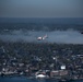 Coast Guard Air Station Cape Cod flies over Volvo Ocean Race Village in Newport, RI