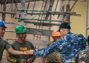 Balikatan 18: Multinational forces add finishing touches to building at Calangitan ES
