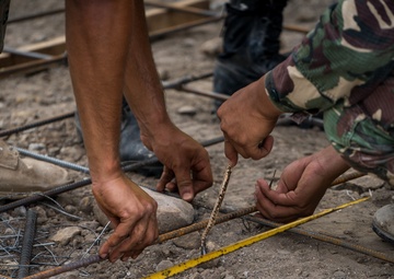 Balikatan 18: Multinational forces add finishing touches to building at Calangitan ES