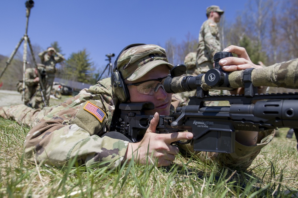 Soldier Adjusts Scope on M2010