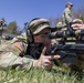 Soldier Adjusts Scope on M2010