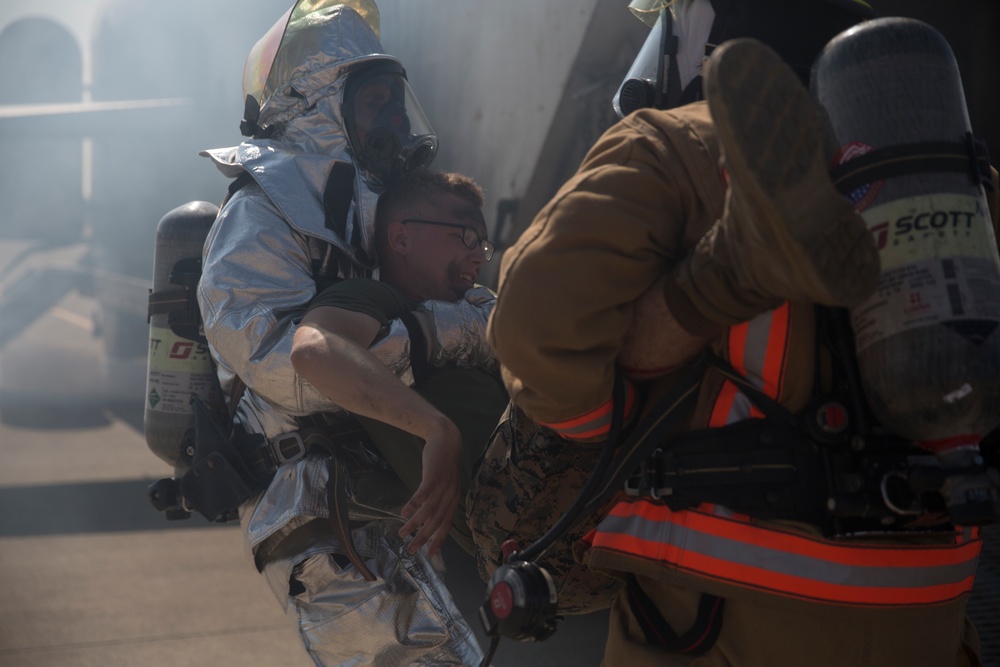 Up in smoke: Marines and Sailors practice Crash, Fire and Rescue training