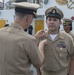 Service members aboard USNS Mercy particpate in a master chief petty officer promotion ceremony