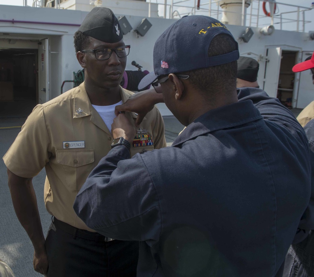 Service members participate in all-hands call aboard USNS Mercy