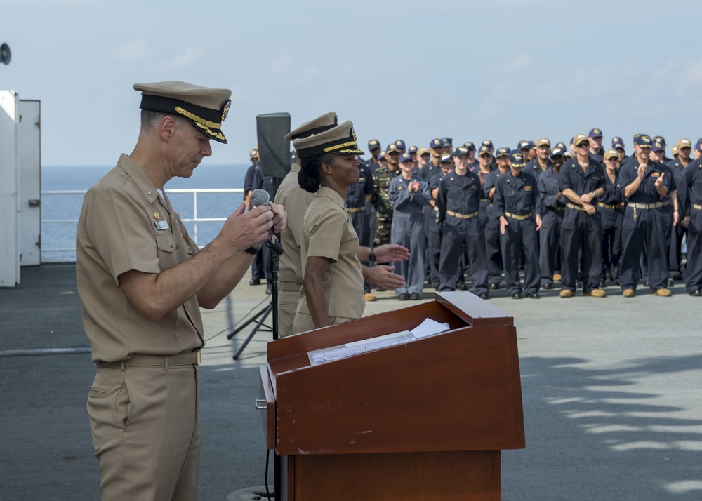 Service members aboard USNS Mercy particpate in a master chief petty officer promotion ceremony