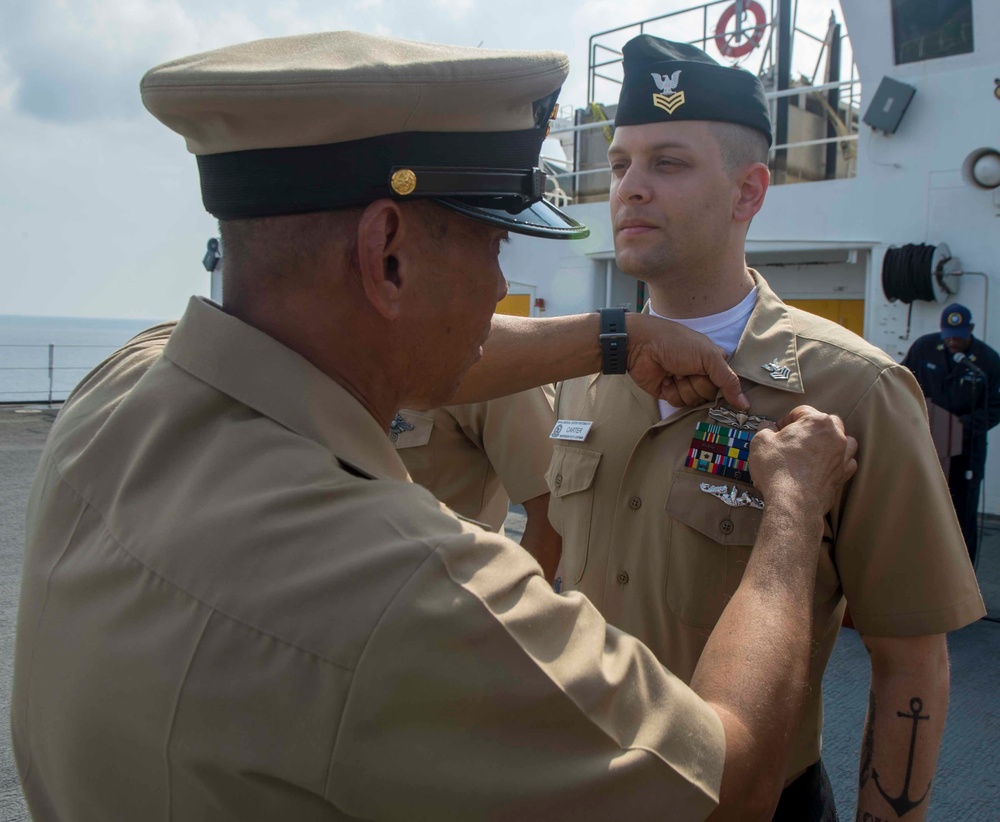 Service members participate in all-hands call aboard USNS Mercy