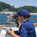 Coast Guard Cutter Douglas Munro crew takes bearings during special sea detail