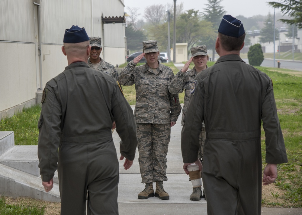 Airmen salute the General