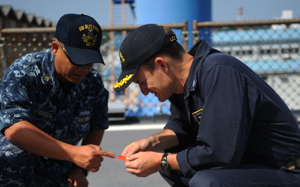 Blue Ridge Sailors preserve the flight deck.
