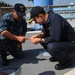 Blue Ridge Sailors preserve the flight deck.