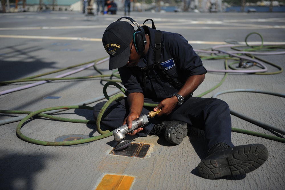 Blue Ridge Sailors preserve the flight deck.