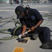 Blue Ridge Sailors preserve the flight deck.